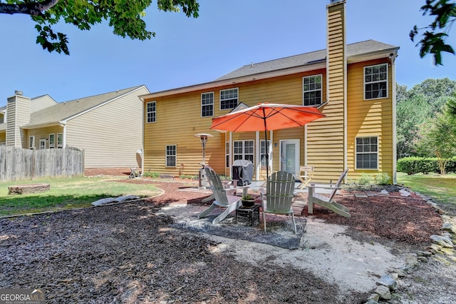 rear view of property featuring a patio area