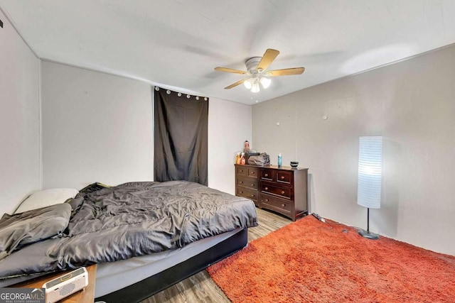 bedroom with ceiling fan and light wood-type flooring