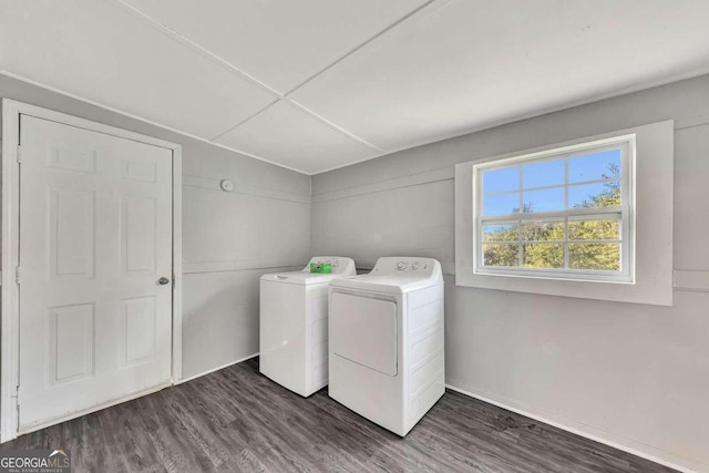 washroom featuring dark wood-type flooring and washing machine and clothes dryer