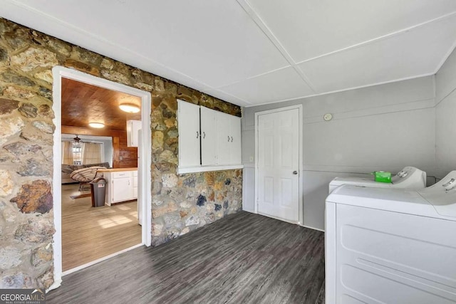 laundry room featuring dark hardwood / wood-style flooring and washer and clothes dryer