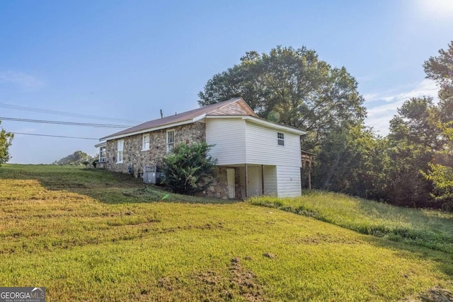 view of property exterior with a yard