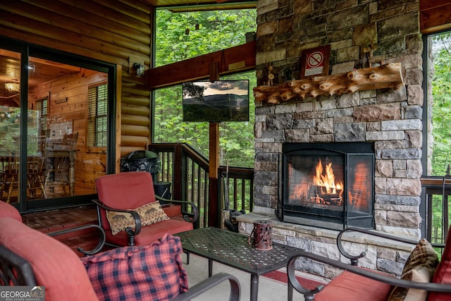 exterior space featuring a stone fireplace