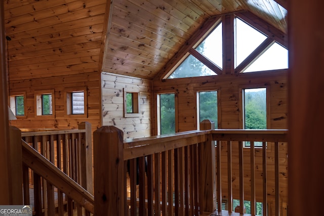 interior space with wood ceiling, high vaulted ceiling, and a healthy amount of sunlight