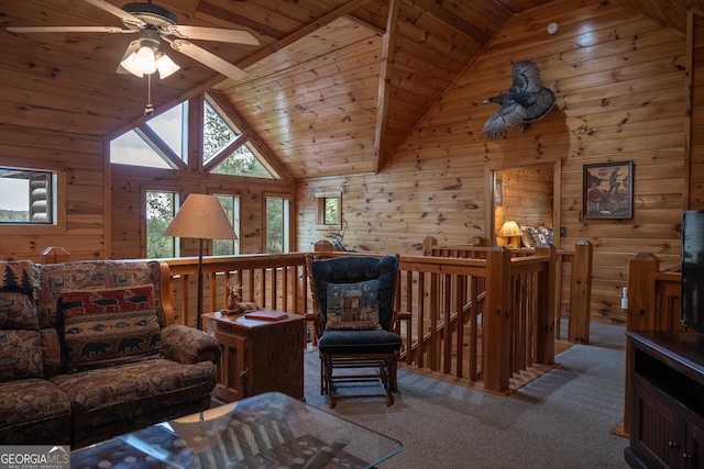 carpeted living room featuring beam ceiling, high vaulted ceiling, wooden ceiling, and wooden walls