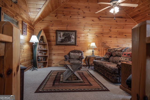 carpeted living room featuring wood walls, lofted ceiling, ceiling fan, and wood ceiling