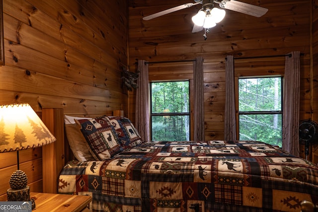 bedroom featuring wood walls