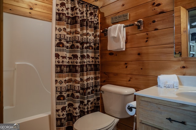 full bathroom featuring wood walls, vanity, shower / bath combo, and toilet