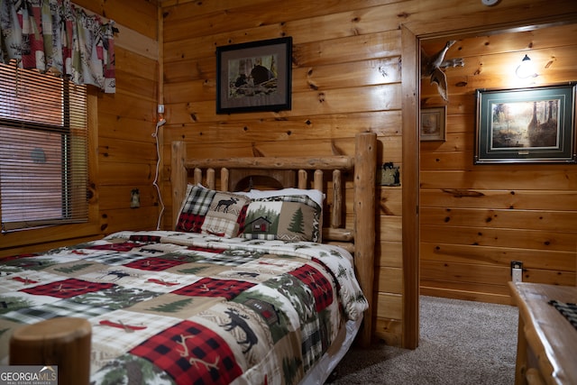 bedroom featuring carpet floors and wood walls