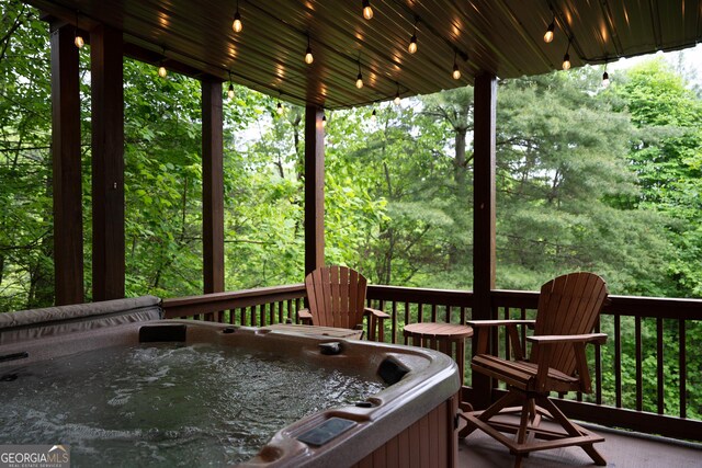 deck with a hot tub