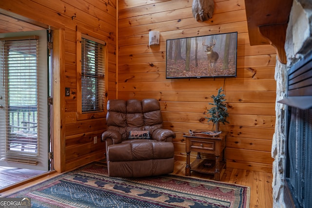 sitting room with hardwood / wood-style floors and a wealth of natural light