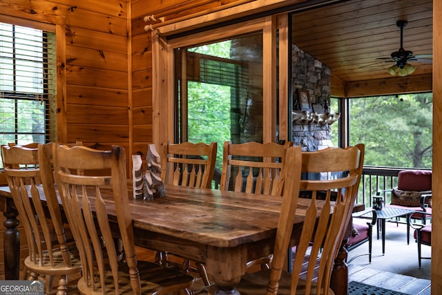 dining space with a wealth of natural light, ceiling fan, and vaulted ceiling