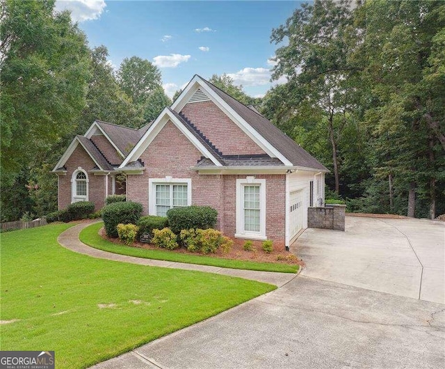 view of front of home with a garage and a front lawn