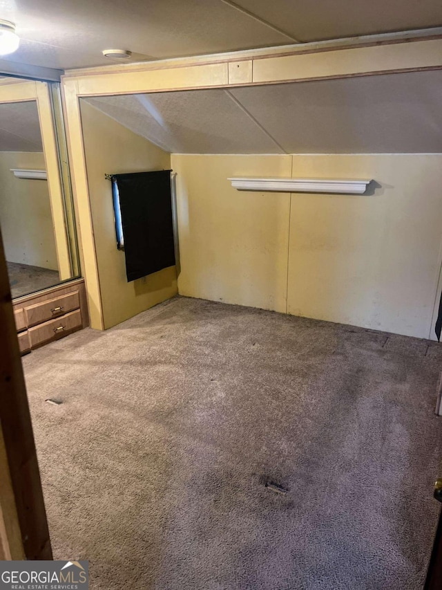 unfurnished bedroom with a closet and carpet floors