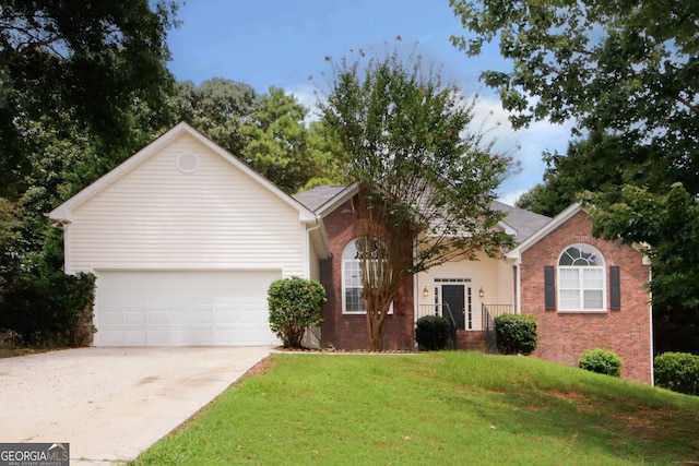 view of front of house with a front lawn and a garage