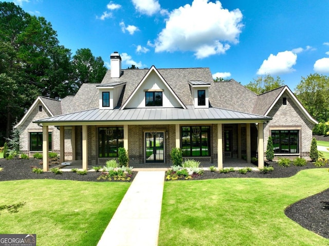 modern farmhouse with covered porch and a front lawn