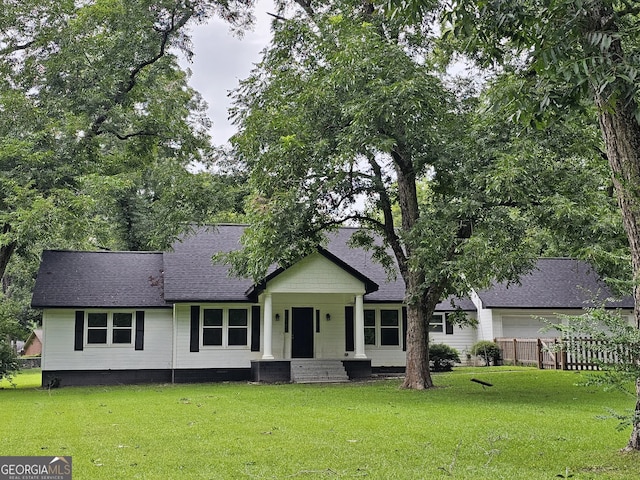 ranch-style home featuring a porch and a front lawn