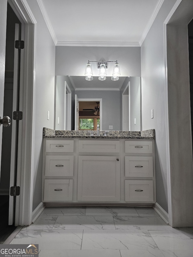 bathroom featuring vanity and crown molding