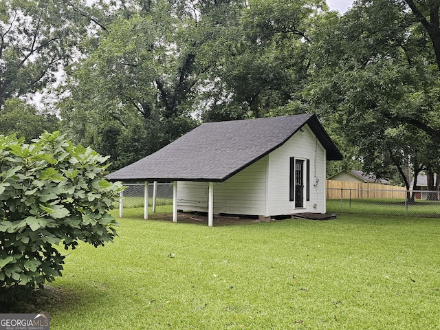 exterior space with an outbuilding and a yard