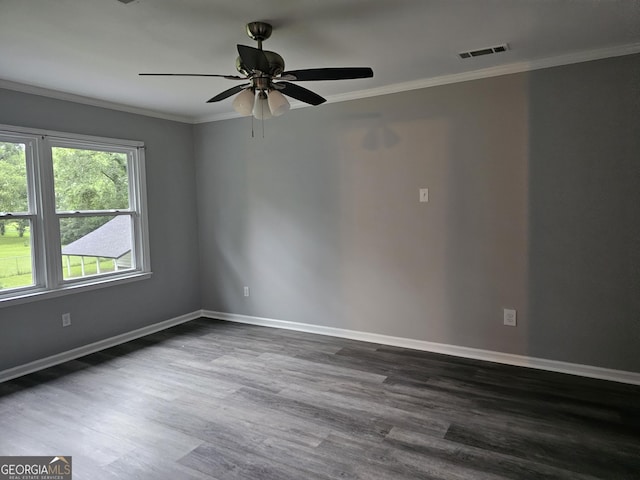 empty room featuring ceiling fan, ornamental molding, and dark hardwood / wood-style floors