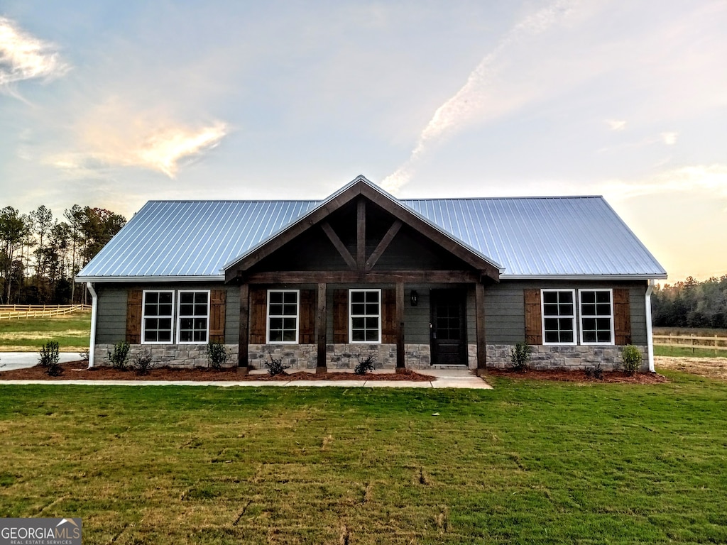 view of front of home with a lawn