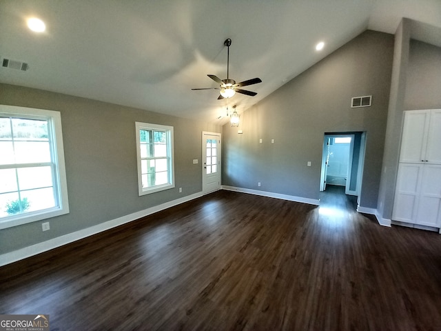 unfurnished living room featuring vaulted ceiling, ceiling fan, and dark hardwood / wood-style flooring