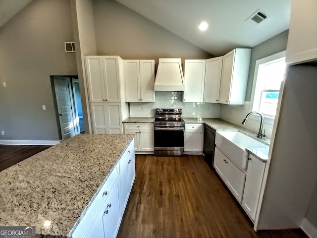 kitchen with premium range hood, white cabinets, and stainless steel range with electric cooktop