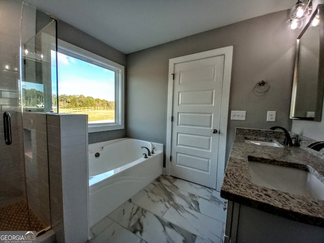 bathroom featuring vanity and independent shower and bath