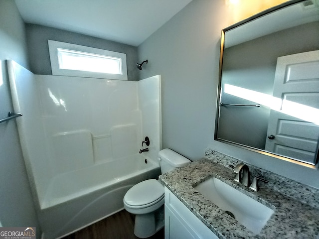 full bathroom with toilet, shower / tub combination, hardwood / wood-style flooring, and vanity