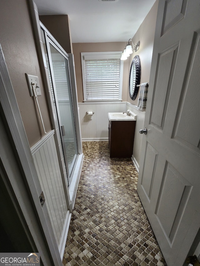 bathroom with vanity and walk in shower