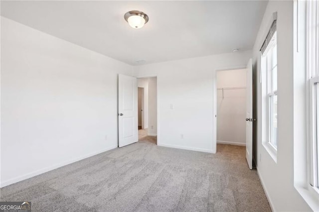 spare room featuring dark colored carpet