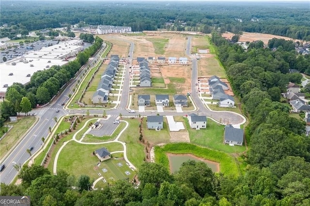 view of community featuring a pergola and a lawn