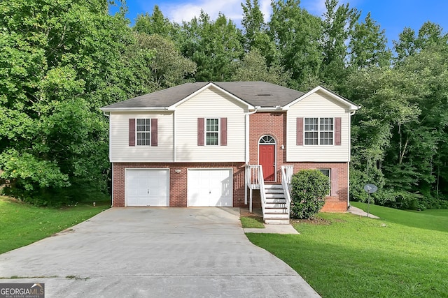 bi-level home with a garage and a front lawn