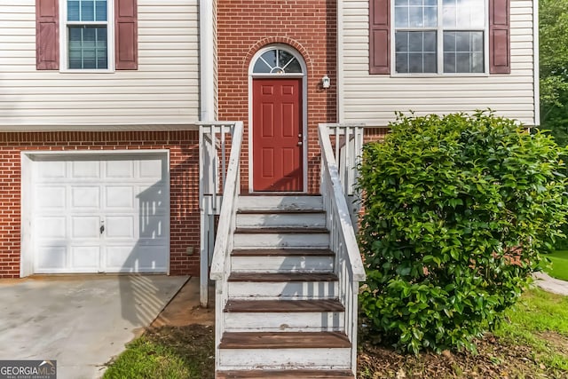 doorway to property featuring a garage