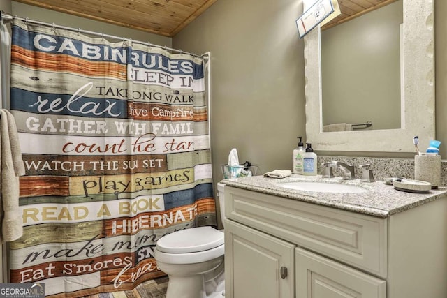 bathroom featuring toilet, vanity, and wooden ceiling