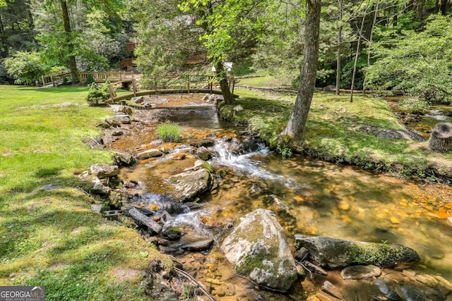 view of landscape with a water view