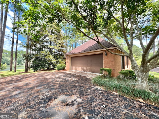 view of side of property featuring a garage