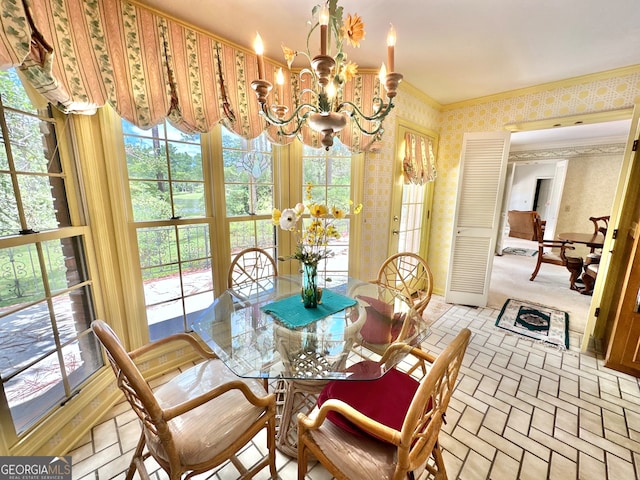 carpeted dining space featuring crown molding, a notable chandelier, and a wealth of natural light