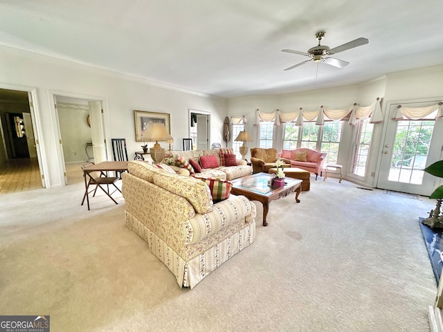 living room with light carpet and ceiling fan