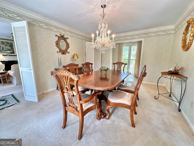 dining space featuring ornamental molding, a notable chandelier, and light colored carpet