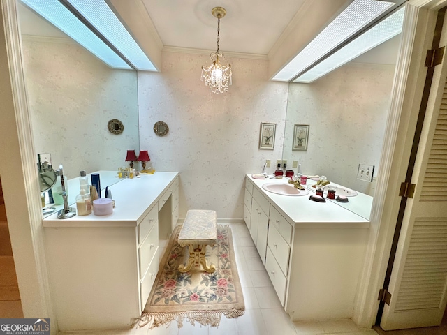 bathroom with vanity, ornamental molding, and tile patterned floors