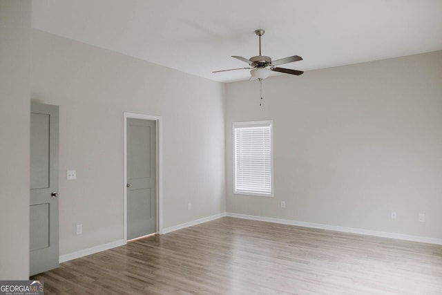 spare room featuring ceiling fan and light hardwood / wood-style floors