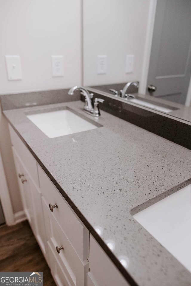 bathroom featuring vanity and wood-type flooring