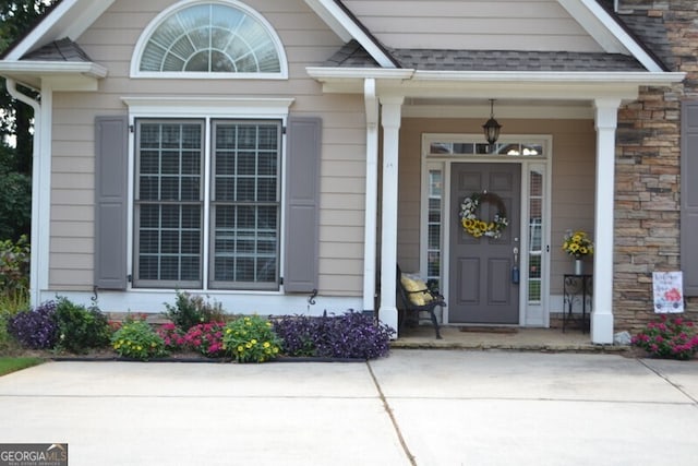 property entrance with covered porch