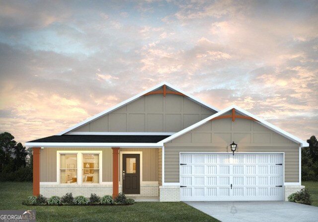 view of front of house with a garage, covered porch, and a yard