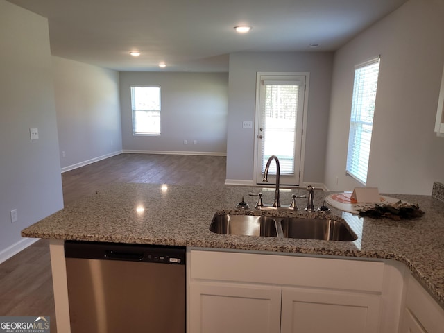 726 Windstream Dr Unit A10, Lagrange, GA 30241 - kitchen with light stone countertops, dark hardwood / wood-style floors, dishwasher, and sink