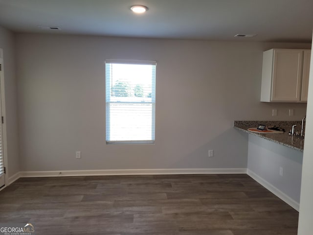 726 Windstream Dr Unit A10, Lagrange, GA 30241 - unfurnished dining area with dark hardwood / wood-style floors