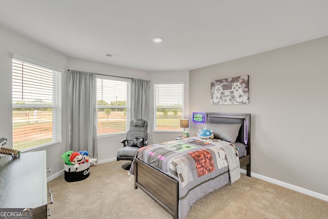 bedroom with carpet flooring, visible vents, and baseboards