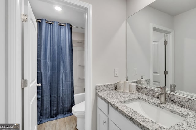 full bathroom with shower / bath combination with curtain, vanity, toilet, and wood finished floors