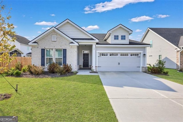 view of front facade with a front yard and a garage