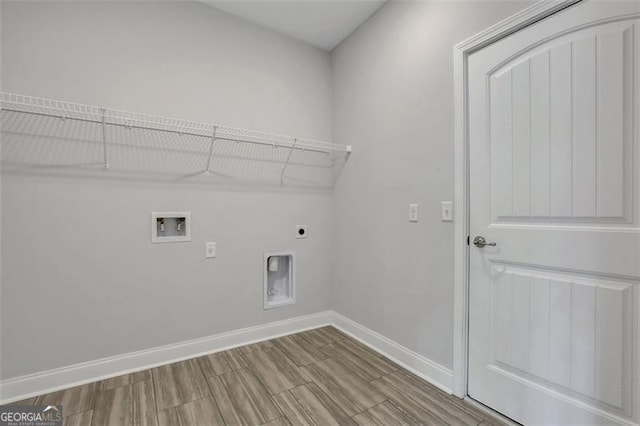 laundry room with washer hookup, electric dryer hookup, and wood-type flooring